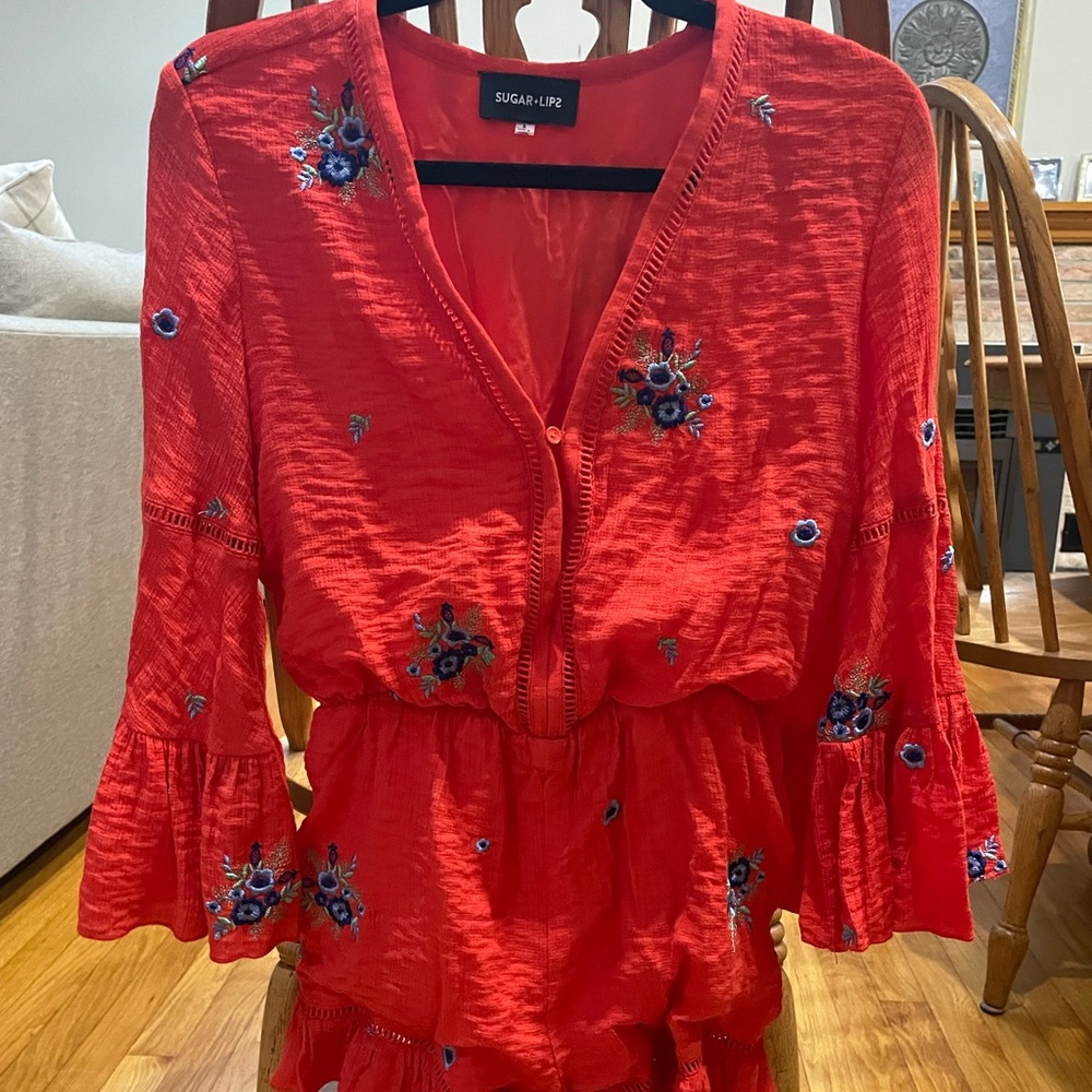 red Floral sugar lips romper with ruffle bottom